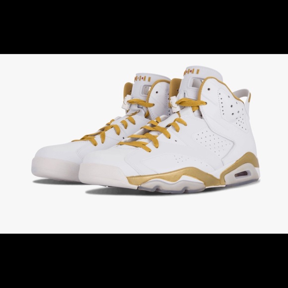 white jordans with gold trim
